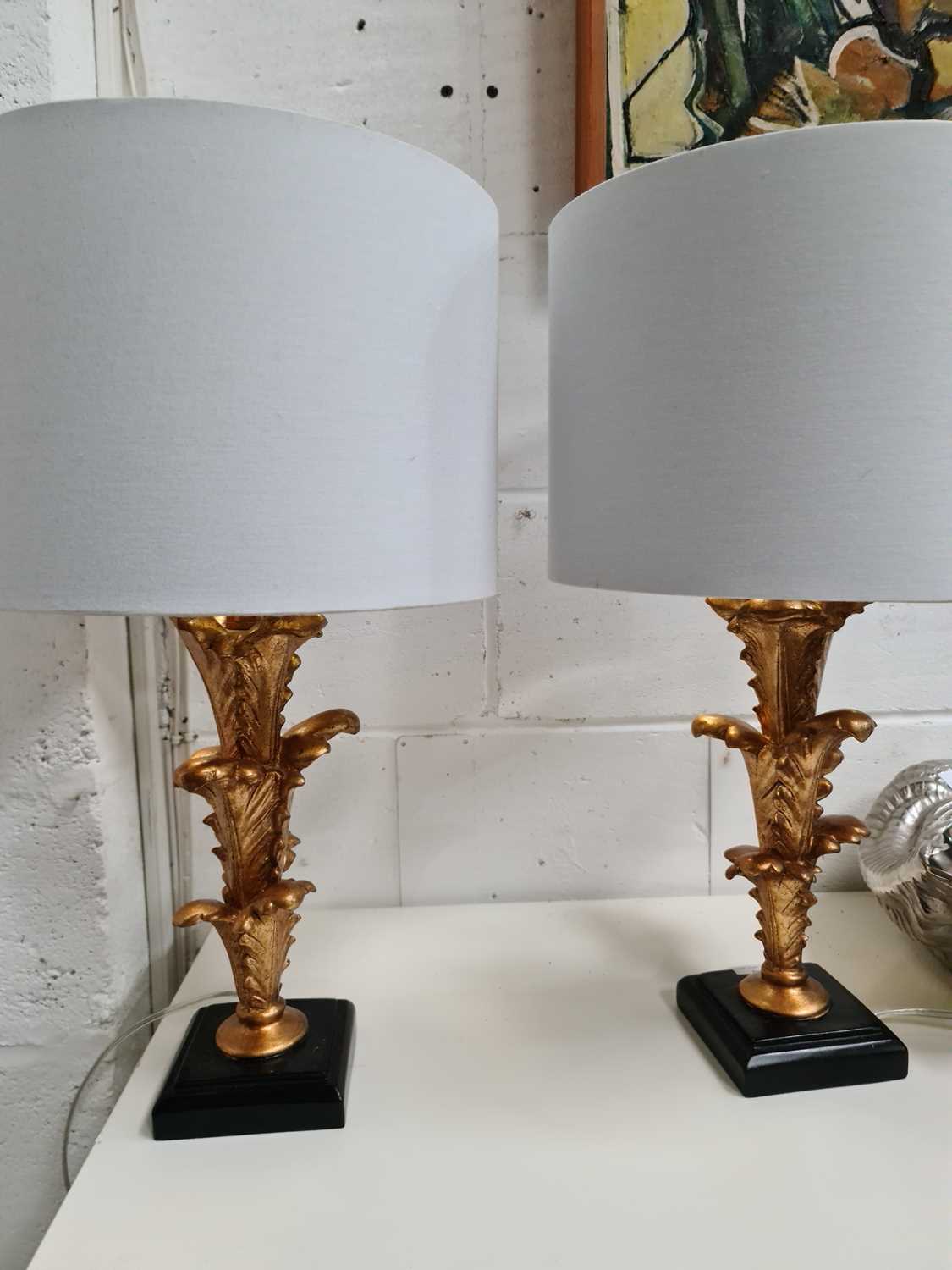 A pair of modern table lamps in the form of leafy sprays with gold lined shades57cm high