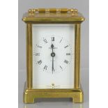 A French Bayard eight-day brass carriage clock, the white dial set with Roman numerals.11cm high