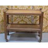 A Robert Thompson 'Mouseman' 1970s tea trolley, the two tiers raised on original castors, carved