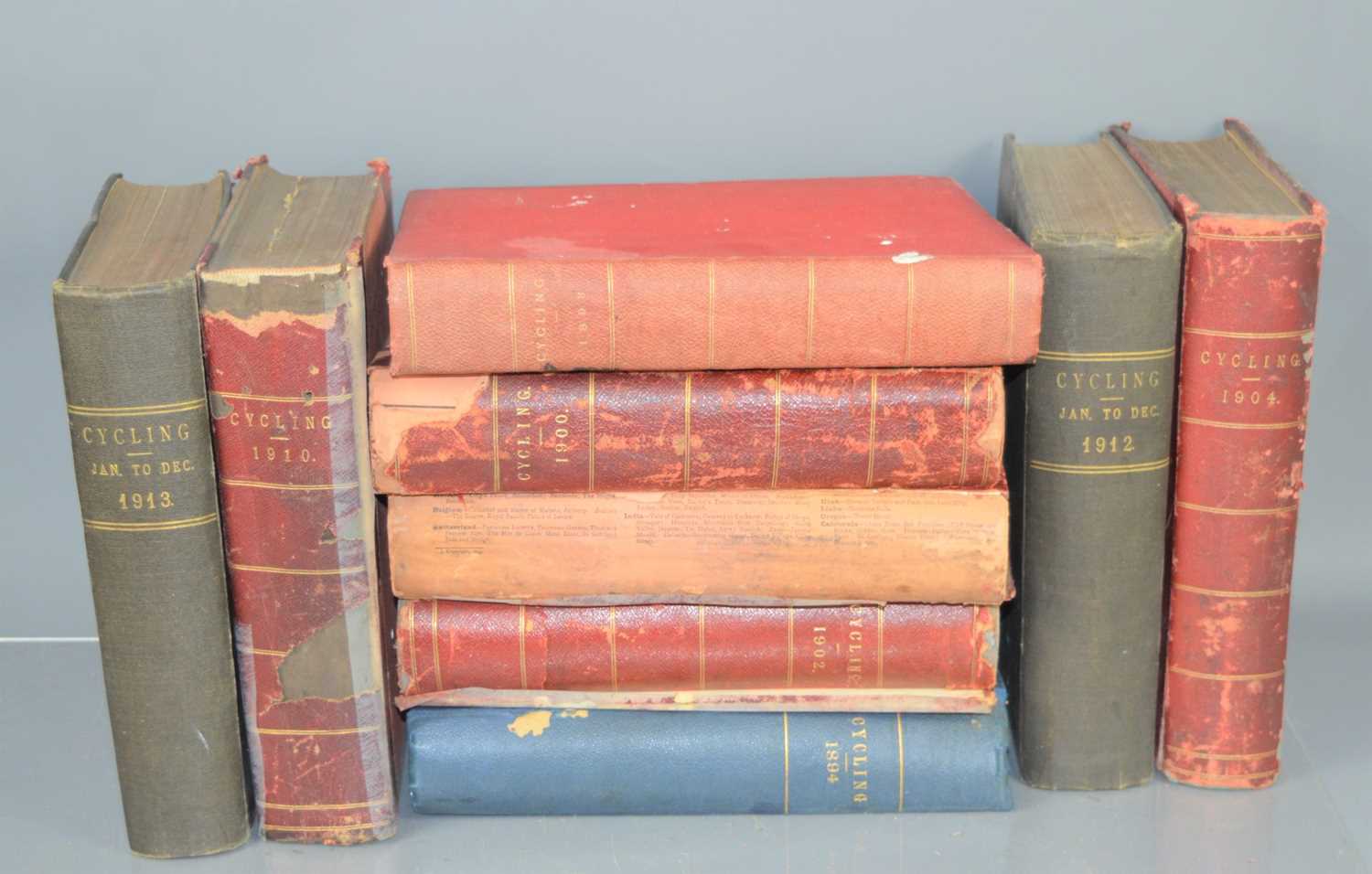 Nine volumes of the "Cycling" book, by Edmund Dangerfield and Walter Groves, late 19th / early