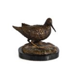 A 20th century bronze sculpture of a snipe, raised on a black marble, unsigned, 17cm high.