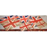 A group of six 1940s British flags, the largest measures 80cm wide, together with some bunting.