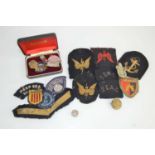 A group of cloth and cap badges to include South East Asia command, WRNS radio operator, Scouts,