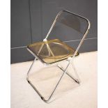 A Italian 1960s chrome and Lucite Plia folding chair by G. Piretti for Castelli.