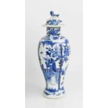 A 19th century Chinese blue and white baluster vase and cover with dog of fo finial, depicting birds