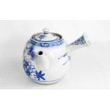 A Japanese blue and white early 20th century teapot with spout form handle, and interior strainer,