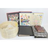 Five stamp albums and a quantity of loose stamps, British and worldwide examples