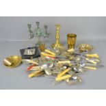 A group of silver plate cutlery and brassware