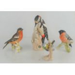 Four Goebel bird figures to include a Blue Titmouse, Bullfinch and others