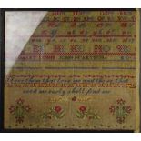 A 19th century sampler, by Dunne and John Carter, bearing peom, alphabet and flowers, 46 by 52cm.
