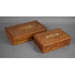 Two Indonesian carved boxes, inlaid with bone in a floral pattern.