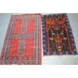 A Middle Eastern prayer mat depicting mosques together with an example with red ground.96cm by 148cm