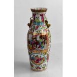 A 19th century Chinese Canton Famille Rose vase, of club form, and modelled with dogs of fo, 25cm