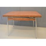 A Modernist extending dining table by Supermatic - France, in Chrome and rosewood effect veneer.