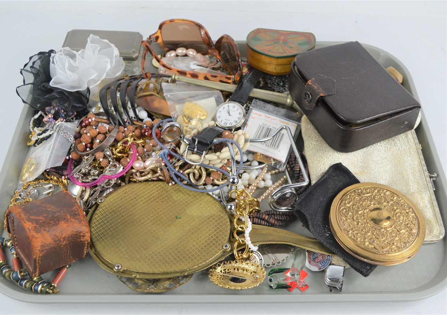 A quantity of vintage jewellery to include necklaces, earrings, brooches, La Rage powder compact,