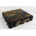 A 19th century papier mache lacquered box, decorated with gilt work and mother of pearl to depict