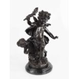 A mid 20th century bronze sculpture of two cherubs holding a flaming torch, raised on a marble