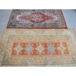 Two wool Middle Eastern rugs one cream ground with Stylised motifs117cm by 202cm - 90cm by 173cm