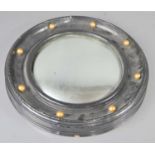 A Victorian porthole convex mirror, black frame.44cm diameter