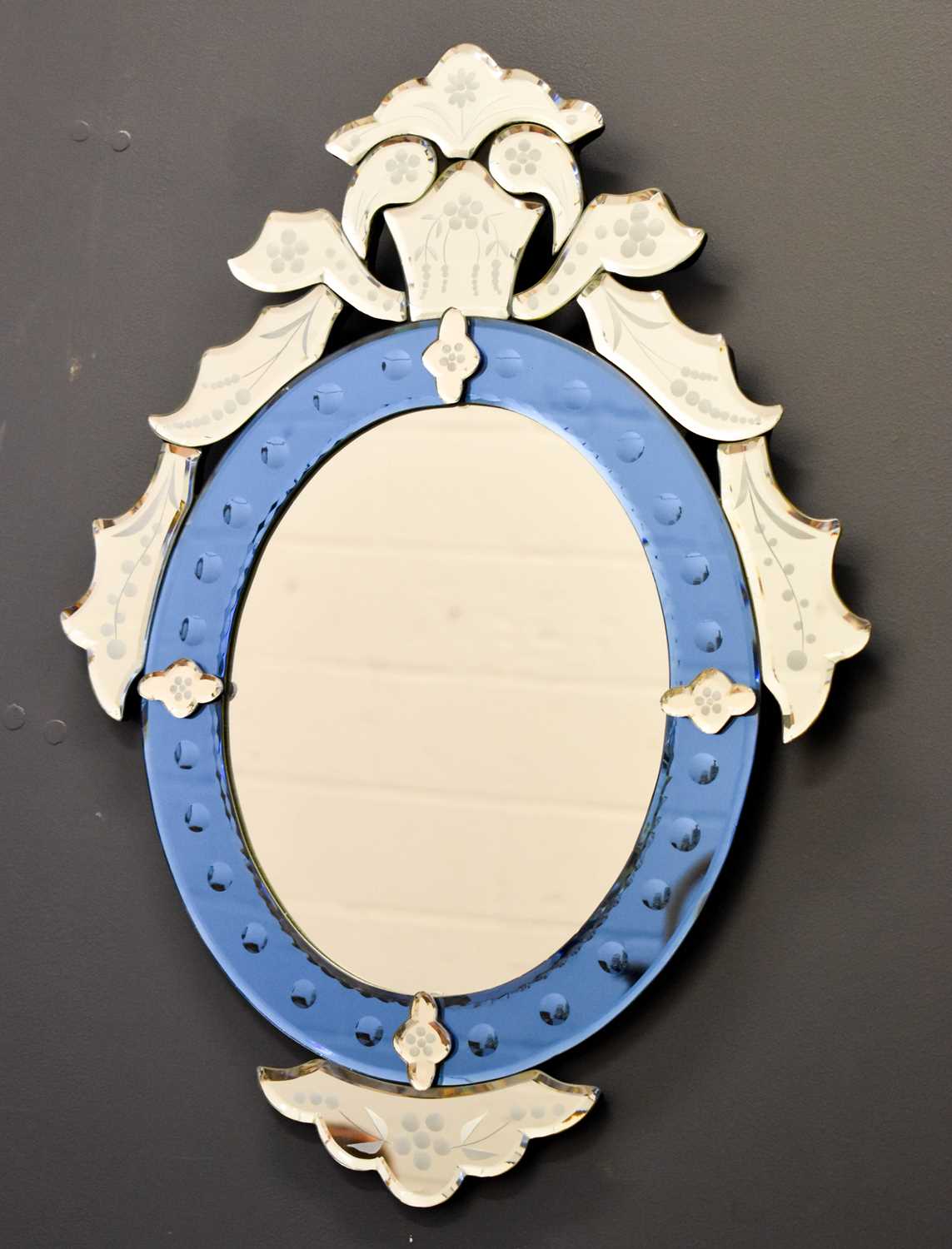 A Venetian style glass wall mirror composed of etched panels56cm high