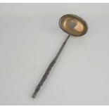 A 19th century white metal toddy ladle baleen handle.