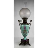 A 19th century Hinks Lever no2 porcelain and gilt metal oil lamp, complete with chimney and etched