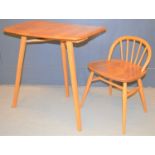 An Ercol elm table extender together with an Ercol style child's chair.