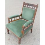 An Edwardian green upholstered parlor chair