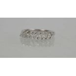 An 18ct white gold and diamond set nine stone ring, each of the marquise cut diamonds of