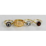 Four 9ct gold rings, set with various gemstones and diamonds, one embossed with floral design, all