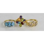 A 14ct gold and diamond plait ring, together with two 9ct gold rings set with coloured gemstones,