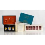 A collection of Lalique scent bottles, sealed with perfume within, comprising Les Flacon Miniatures,