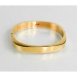 A 14ct gold bangle, of square form with rounded corners, 18.11g.