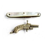 A 19th century white metal miniature pistol pendant, together with a mother of pearl fruit knife