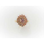 A 9ct gold and garnet cluster ring, 3.35g, size P 1/2