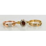 A 9ct gold, diamond and garnet flowerhead ring, size N/O, a 9ct rose gold and diamond cluster