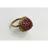 A 14ct gold and pink sapphire cluster ring, on a basket setting, size O, 5.5g.