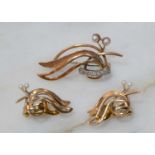 A pair of 18ct gold backed and pearl vintage earrings, of stylised wave form each with two seed