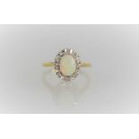 A 9ct gold, opal and diamond ring, 3.8g, size M