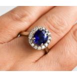 A platinum, sapphire and diamond cluster ring, size N½, 7g.