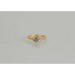 An 18ct gold, diamond and sapphire ring of twisted design, size M, 1.99g.