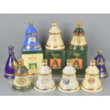 Twelves Bells old Scotch whiskey decanters with contents, Christmas and commemorative editions, some