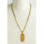 An 18ct gold pendant necklace, the necklace composed of chain links, and the pendant having Egyptian