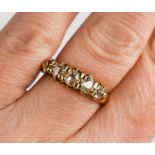 An 18ct gold and diamond ring, the five graduated old cut diamonds in an antique claw setting,