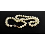 A fine cultured pearl necklace, with a 9ct gold ball form clasp inset with diamonds, 37.41g.