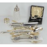 A collection of silver wares, comprising a christening set of spoon and pusher, a napkin ring, a cut