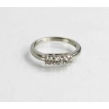 A platinum and diamond three stone ring, the brilliant cut diamonds approximately 0.50cts in