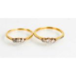 Two similar 18ct gold and diamond trilogy rings, size N and J, 3.25g in total.