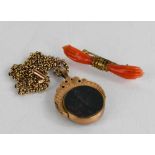 A coral brooch in the form of two hands, together with a 10ct gold and agate spinning pendant