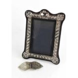 A silver photograph frame, on velvet back and stand, Keyford Frames Ltd, London 1985, internal